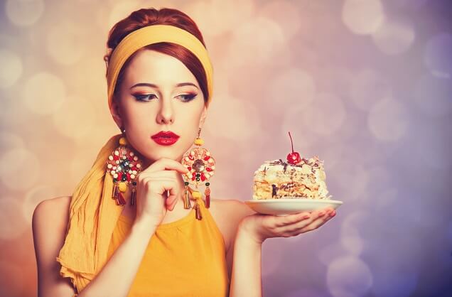 Woman looking at piece of cake