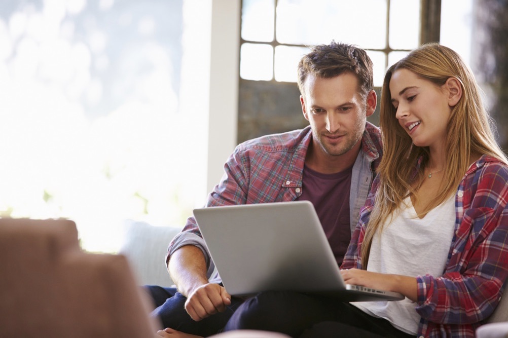 Picking Winning Lotto Numbers Couple With Laptop