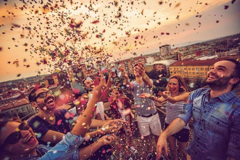Famous Lottery Winners People celebrating a famous lottery win by throwing confetti in the air