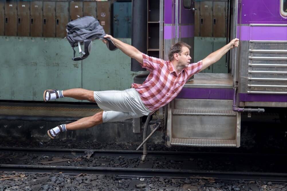 Lottery Deadlines Man holds onto a moving train