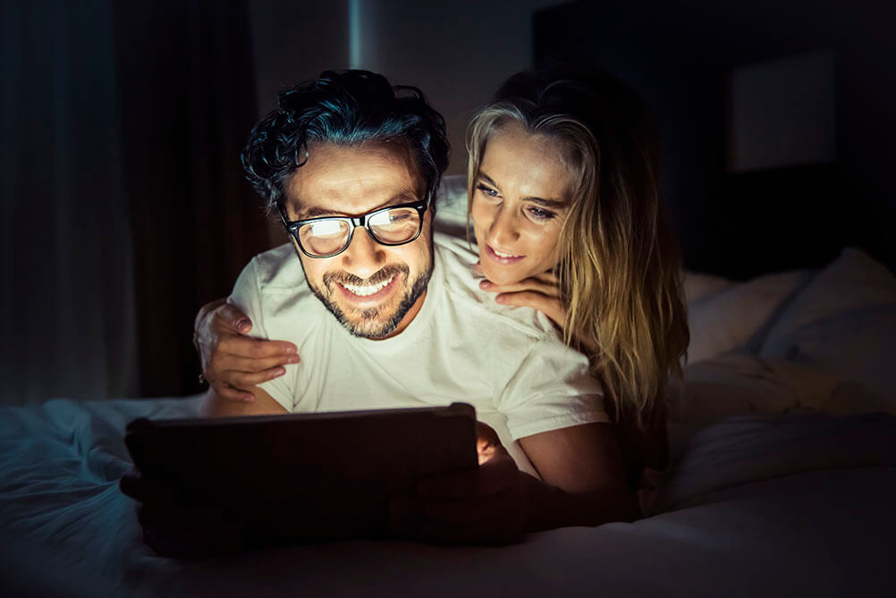 Millionaire Superdraw is Coming Couple checking out the Millionaire lottery product online at Lottoland
