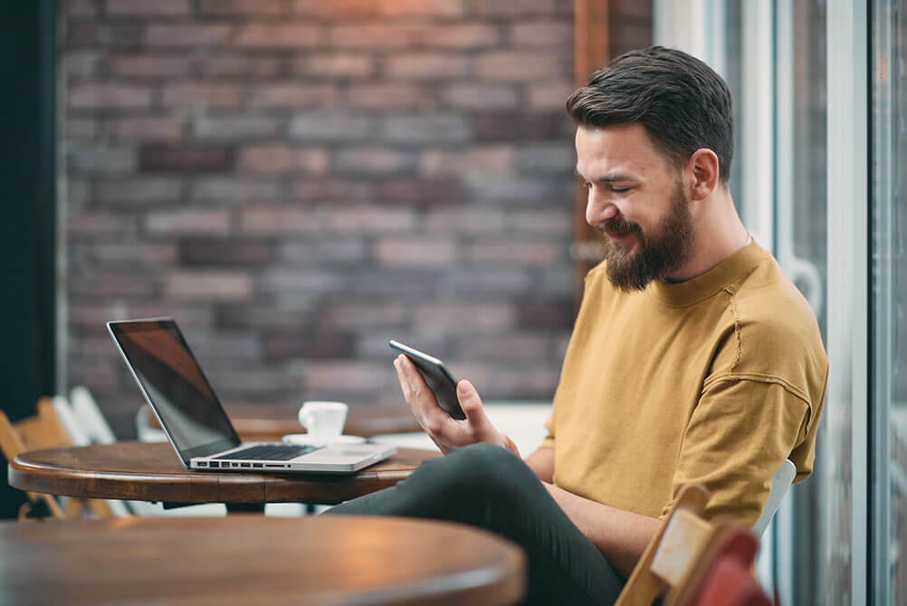 Man checks out an annuity game on his phone