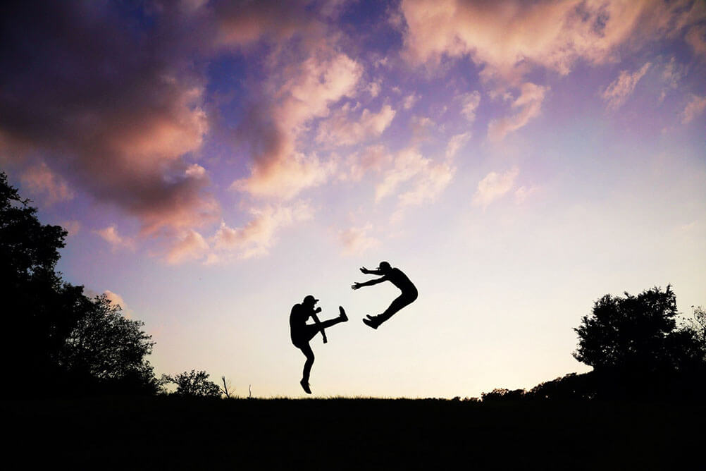 People practise karate at dawn