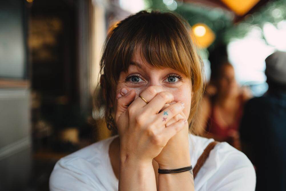 shocked-woman shocked-woman-who-won-the-lottery-covering-mouth