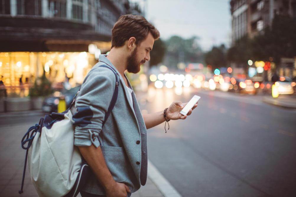 Man-checking-phone-for-next-lottery