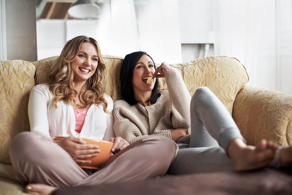 Lottery Themes in TV and Movies Two friends watching TV and movies with lottery themes