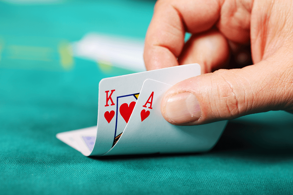 Blackjack Side Bet 21+3 A hand showing 2 cards on a poker table
