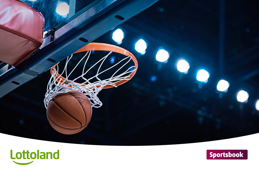 How to bet on basketball Basketball hoop with ball in mid-air, perfect for basketball betting enthusiasts looking to learn how to bet on basketball.